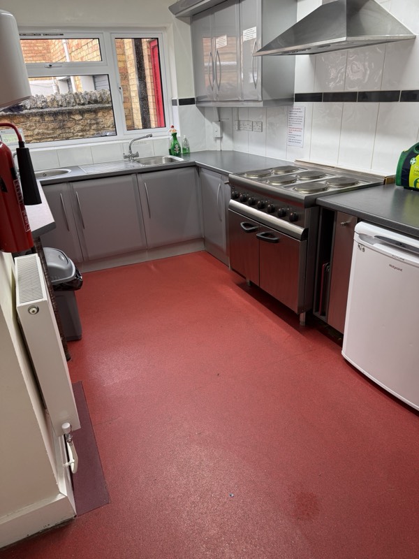 The fitted kitchen, with sink, cooker, hob, extractor and fridge